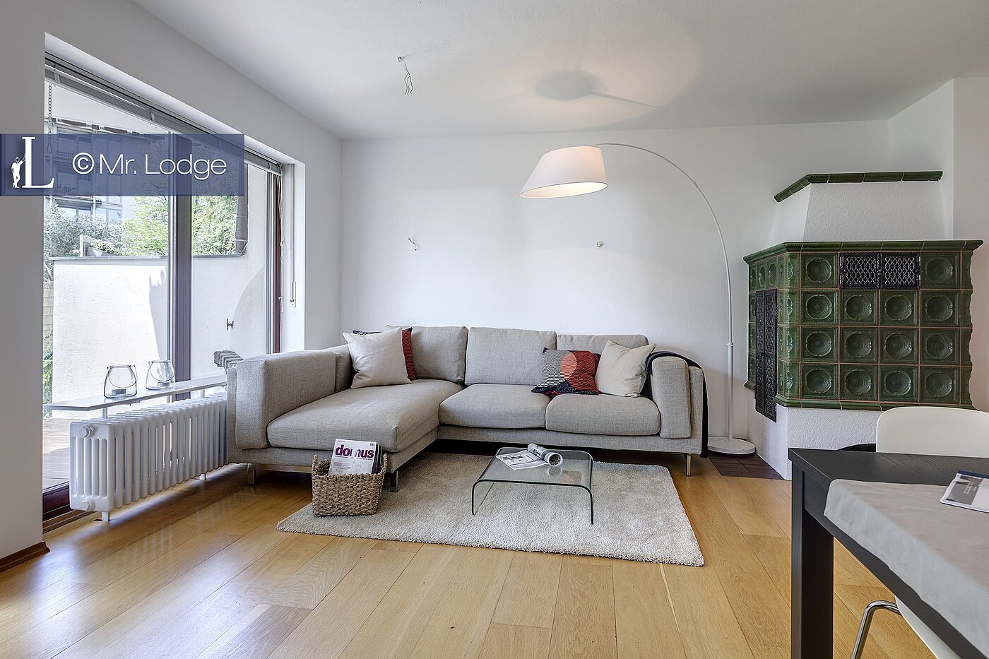 Piso en planta baja de 2 habitaciones | München-Harlaching | 1704ML6 | Wohnzimmer mit Kachelofen